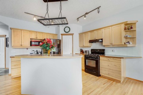 144 Bow Ridge Drive, Cochrane, AB - Indoor Photo Showing Kitchen