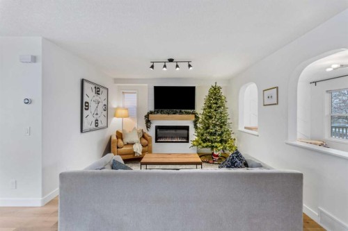 143 Prestwick Heath Se, Calgary, AB - Indoor Photo Showing Living Room With Fireplace