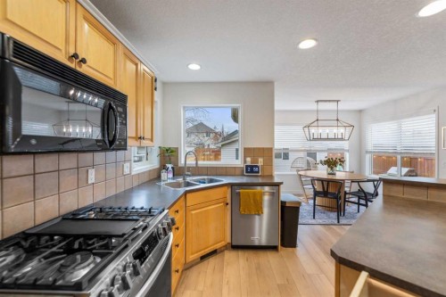 143 Prestwick Heath Se, Calgary, AB - Indoor Photo Showing Kitchen With Double Sink
