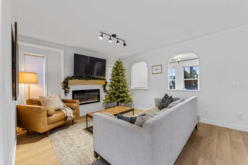 143 Prestwick Heath Se, Calgary, AB - Indoor Photo Showing Living Room With Fireplace