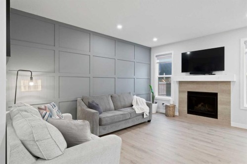 21 Seton Parade Se, Calgary, AB - Indoor Photo Showing Living Room With Fireplace