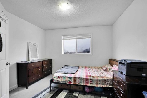 63 Martinbrook Road Ne, Calgary, AB - Indoor Photo Showing Bedroom
