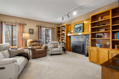 2331 Morris Crescent Se, Airdrie, AB - Indoor Photo Showing Living Room With Fireplace