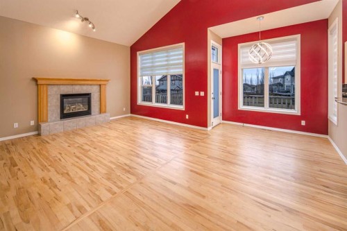 18 Hidden Creek Point Nw, Calgary, AB - Indoor Photo Showing Living Room With Fireplace