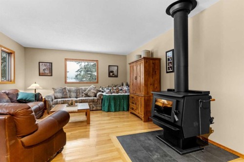 101-04042 Highway 587, Rural Red Deer County, AB - Indoor Photo Showing Living Room With Fireplace