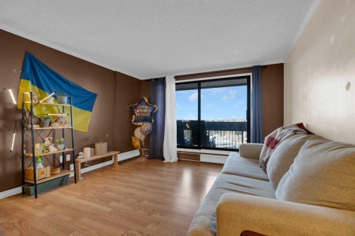 1006-9800 Horton Road Sw, Calgary, AB - Indoor Photo Showing Living Room