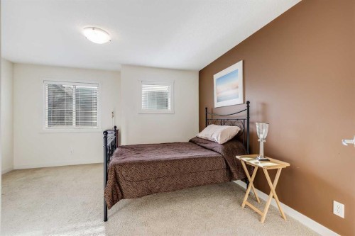 704-2445 Kingsland Road Se, Airdrie, AB - Indoor Photo Showing Bedroom