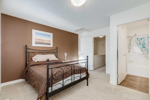 704-2445 Kingsland Road Se, Airdrie, AB - Indoor Photo Showing Bedroom