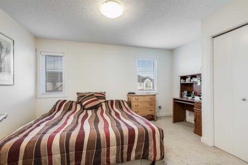 704-2445 Kingsland Road Se, Airdrie, AB - Indoor Photo Showing Bedroom