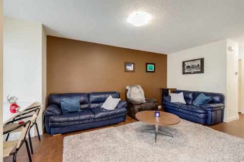 704-2445 Kingsland Road Se, Airdrie, AB - Indoor Photo Showing Living Room