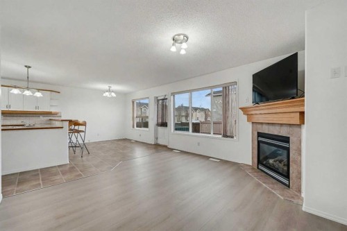 12 Tarawood Grove Ne, Calgary, AB - Indoor Photo Showing Living Room With Fireplace