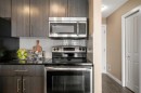 412-5 Saddlestone Way Ne, Calgary, AB  - Indoor Photo Showing Kitchen With Upgraded Kitchen 