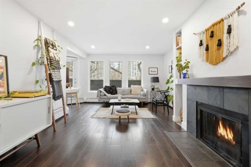 310-1111 13 Avenue Sw, Calgary, AB - Indoor Photo Showing Living Room With Fireplace