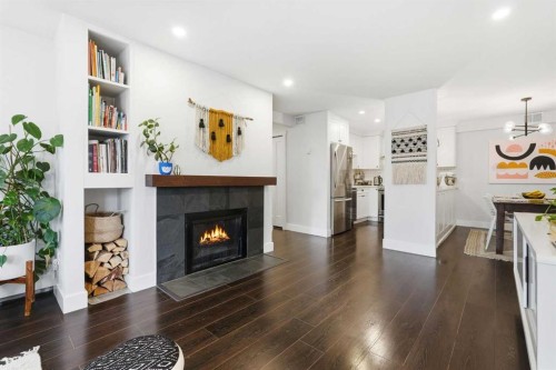310-1111 13 Avenue Sw, Calgary, AB - Indoor Photo Showing Living Room With Fireplace