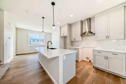 32 Creekside Rise Sw, Calgary, AB - Indoor Photo Showing Kitchen With Upgraded Kitchen