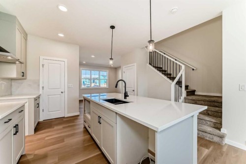 32 Creekside Rise Sw, Calgary, AB - Indoor Photo Showing Kitchen With Double Sink