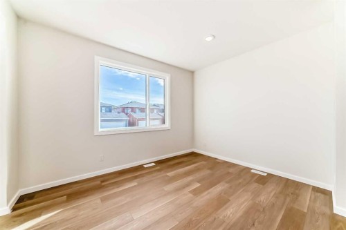 32 Creekside Rise Sw, Calgary, AB - Indoor Photo Showing Other Room