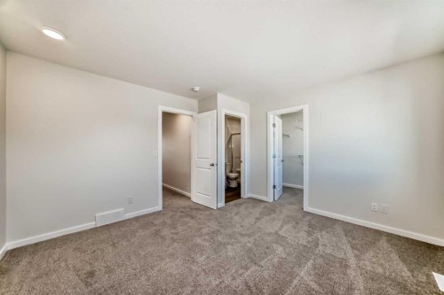 32 Creekside Rise Sw, Calgary, AB - Indoor Photo Showing Other Room