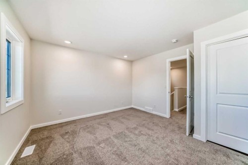 32 Creekside Rise Sw, Calgary, AB - Indoor Photo Showing Other Room