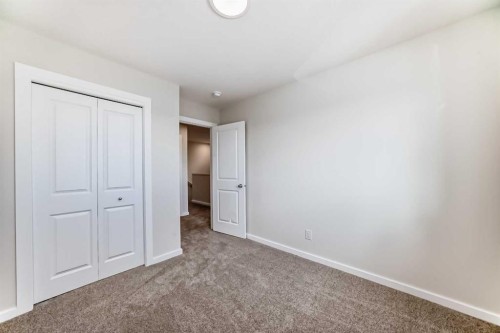 32 Creekside Rise Sw, Calgary, AB - Indoor Photo Showing Other Room
