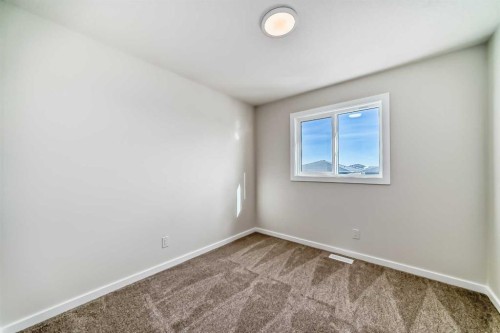 32 Creekside Rise Sw, Calgary, AB - Indoor Photo Showing Other Room