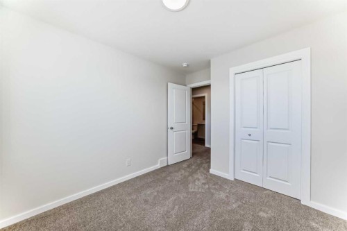 32 Creekside Rise Sw, Calgary, AB - Indoor Photo Showing Other Room