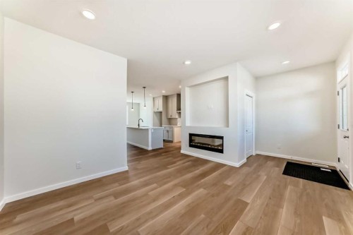32 Creekside Rise Sw, Calgary, AB - Indoor With Fireplace