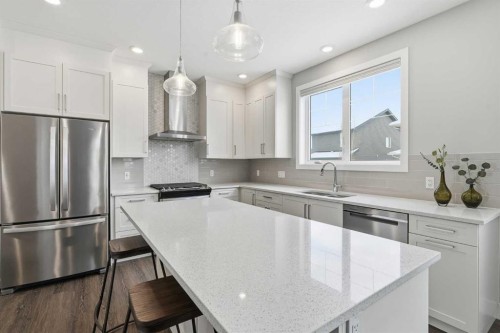 204-20 Silverado Crest Park Sw, Calgary, AB - Indoor Photo Showing Kitchen With Double Sink With Upgraded Kitchen