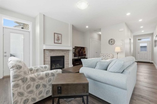204-20 Silverado Crest Park Sw, Calgary, AB - Indoor Photo Showing Living Room With Fireplace