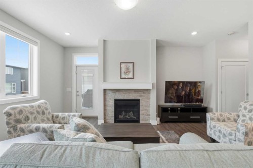 204-20 Silverado Crest Park Sw, Calgary, AB - Indoor Photo Showing Living Room With Fireplace