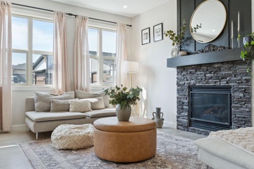 206 Riviera View, Cochrane, AB - Indoor Photo Showing Living Room With Fireplace