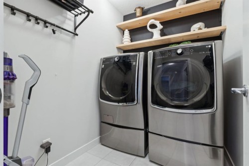 206 Riviera View, Cochrane, AB - Indoor Photo Showing Laundry Room