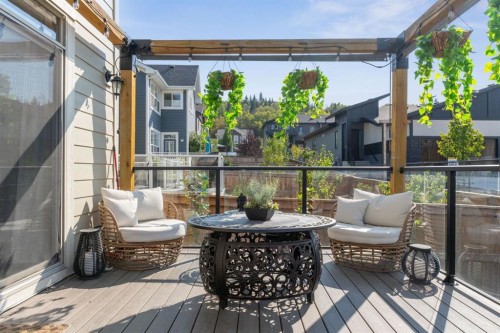 206 Riviera View, Cochrane, AB - Outdoor With Deck Patio Veranda With Exterior