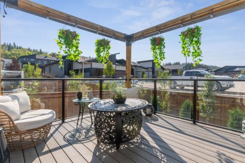 206 Riviera View, Cochrane, AB - Outdoor With Deck Patio Veranda With Exterior