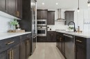 206 Riviera View, Cochrane, AB  - Indoor Photo Showing Kitchen With Upgraded Kitchen 