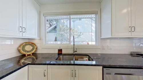 2932 Lathom Crescent Sw, Calgary, AB - Indoor Photo Showing Kitchen With Double Sink