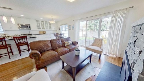 2932 Lathom Crescent Sw, Calgary, AB - Indoor Photo Showing Living Room