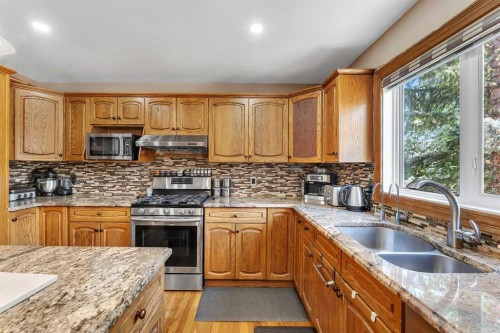 33 Edgevalley Way Nw, Calgary, AB - Indoor Photo Showing Kitchen With Double Sink