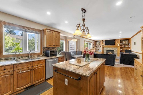 33 Edgevalley Way Nw, Calgary, AB - Indoor Photo Showing Kitchen With Fireplace