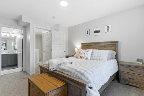 410-338 Seton Circle Se, Calgary, AB - Indoor Photo Showing Bedroom