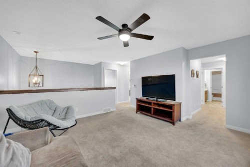 264 Boulder Creek Crescent Se, Langdon, AB - Indoor Photo Showing Living Room