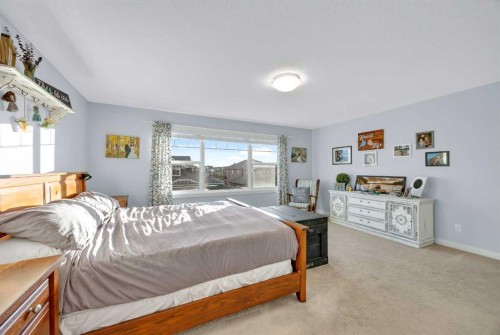 264 Boulder Creek Crescent Se, Langdon, AB - Indoor Photo Showing Bedroom