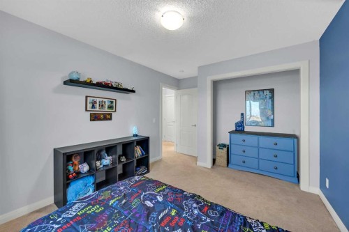 264 Boulder Creek Crescent Se, Langdon, AB - Indoor Photo Showing Bedroom