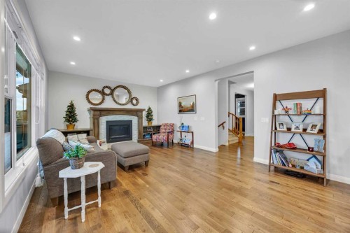 264 Boulder Creek Crescent Se, Langdon, AB - Indoor Photo Showing Living Room With Fireplace