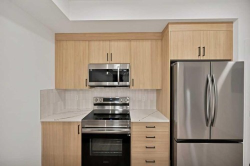 572 Seton Circle, Calgary, AB - Indoor Photo Showing Kitchen With Stainless Steel Kitchen