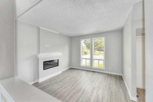 802-5340 17 Avenue Sw, Calgary, AB - Indoor With Fireplace