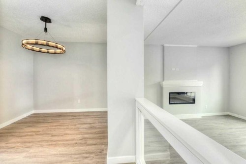 802-5340 17 Avenue Sw, Calgary, AB - Indoor With Fireplace