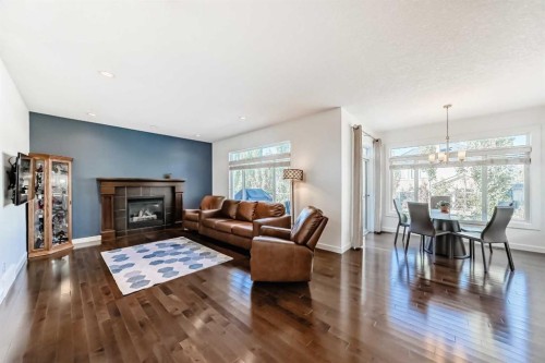 136 Aspenmere Close, Chestermere, AB - Indoor Photo Showing Living Room With Fireplace