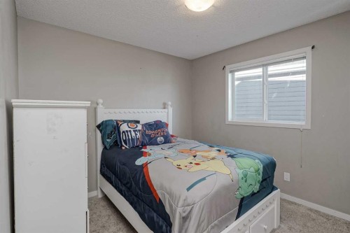 216 Copperpond Green Se, Calgary, AB - Indoor Photo Showing Bedroom