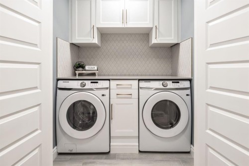 135 Belgian Crescent, Cochrane, AB - Indoor Photo Showing Laundry Room